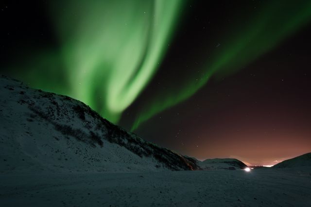 Mesmerizing Northern Lights Over Snowy Mountains - Download Free Stock Photos Pikwizard.com