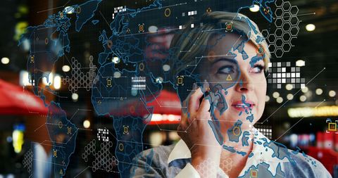 Woman Using Smartphone with Digital World Map Overlay at Night