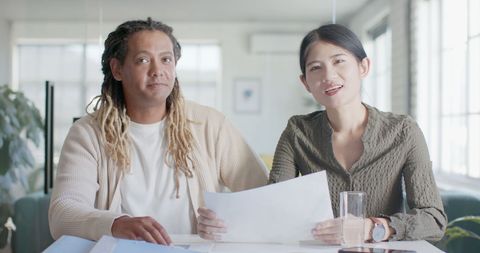 Diverse Colleagues in Virtual Meeting at Office Desk