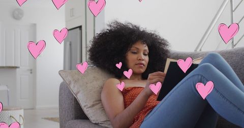 Relaxed Woman Reading on Sofa with Animated Hearts