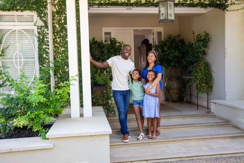 Loving African American Family Smiling Together on Porch