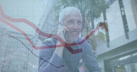 Smiling mature businessman discussing data analysis on phone
