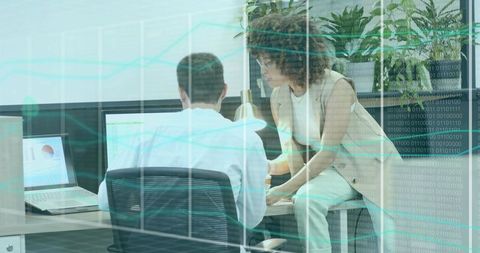 Diverse Work Team Discussing Analytics in Modern Office