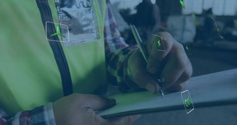 Warehouse inspector writing checklist on clipboard with augmented reality hud overlay