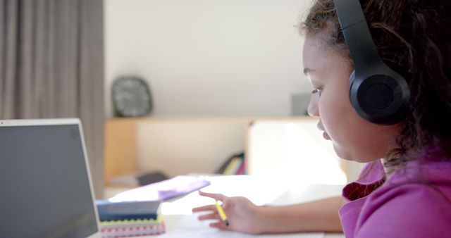 Focused African American Girl Studying Online with Headphones - Download Free Stock Images Pikwizard.com