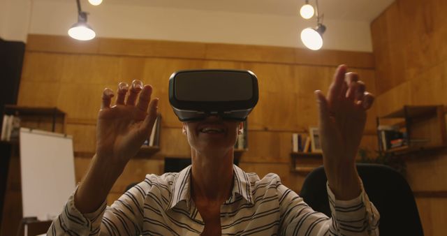 Woman Experiencing Virtual Reality in Office - Download Free Stock Images Pikwizard.com