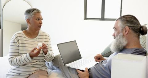 Senior Couple Engages in Modern Living and Provides Supportive Companionship