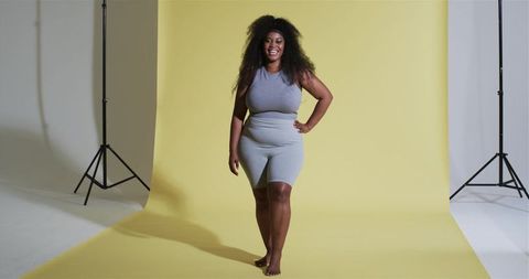 Confident African American Athlete in Studio with Yellow Backdrop