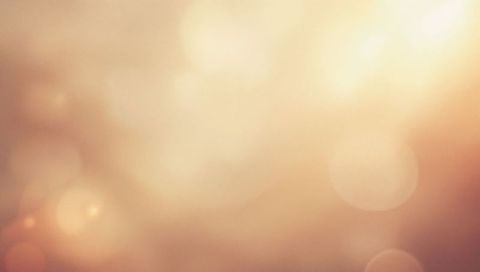 Warm Golden Bokeh Glow with Soft Lens Flare and Abstract Light Halos