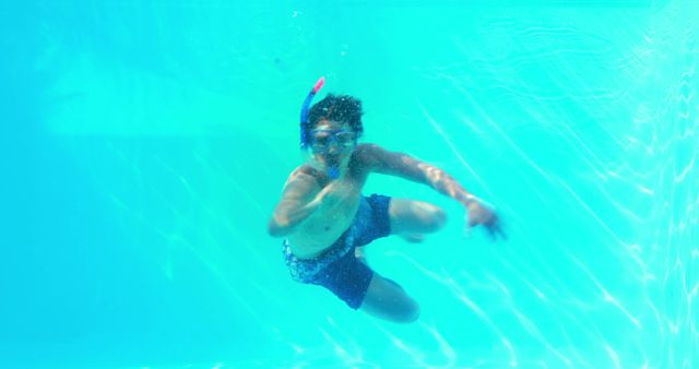 Boy Snorkeling Underwater with Mask in Clear Blue Pool - Download Free Stock Images Pikwizard.com