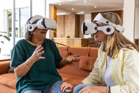 Senior Women Enjoying Virtual Reality Technology Together