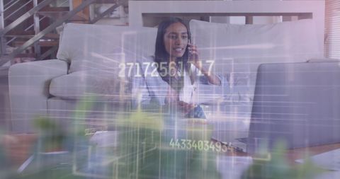 Businesswoman Analyzing Data with Laptop Interface Overlay