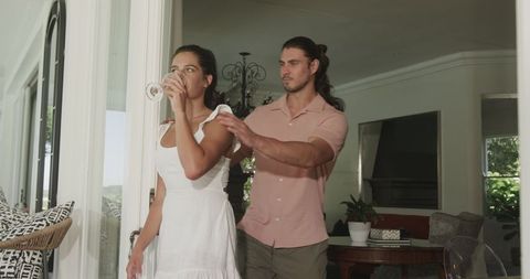 Romantic proposal moment at home with joyful couple