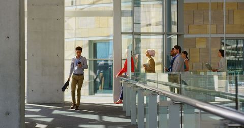 Diverse Professionals Walking in Modern Office Corridor - Download Free Stock Images Pikwizard.com