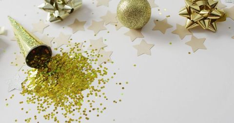 Festive golden decorations and stars on white background
