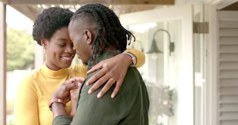Romantic African American Couple Embracing on Porch