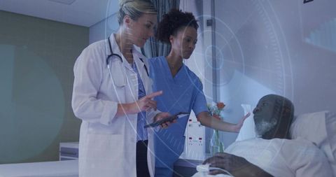White doctor and black nurse consulting black elder patient using tablet with digital hud