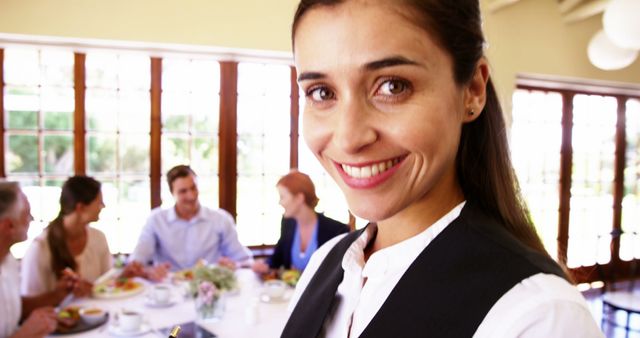 Businesswoman Smiling during Team Meeting in Bright Office - Download Free Stock Images Pikwizard.com