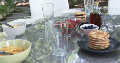 Outdoor Breakfast Spread with Pancakes and Fresh Berries on Garden Table - Download Free Stock Images Pikwizard.com