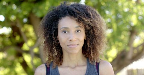 Portrait of confident woman with curly hair