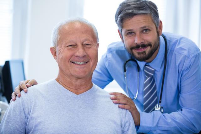 Portrait of a male doctor and patient at the hospital