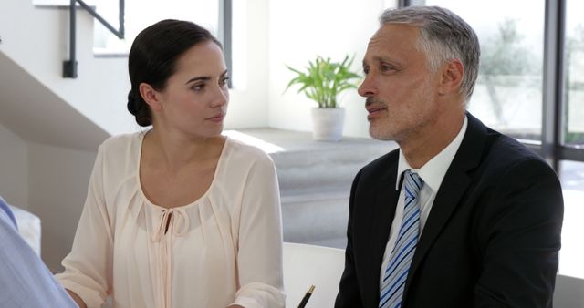 Businessman and colleague having discussion in modern office - Download Free Stock Images Pikwizard.com