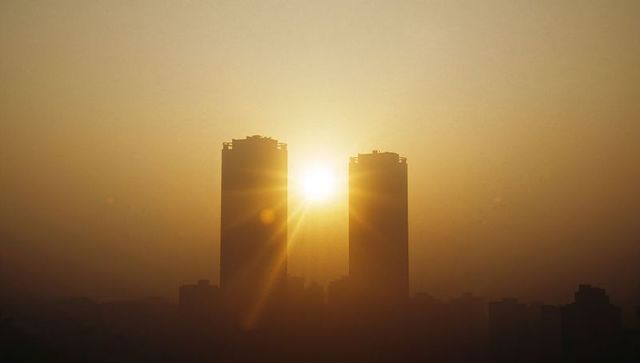 Urban Sunrise Silhouetting Skyscraper Towers at Dawn