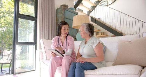 Home Healthcare Consultation with Senior Woman