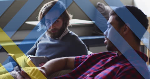 Diverse Businessmen Multitasking with Tablets Discussing Ideas