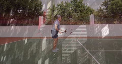 Senior Man Playing Tennis Outdoors in Bright Sunlight