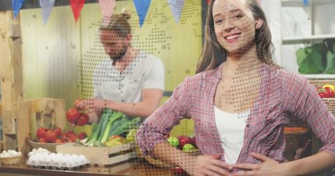 Smiling market vendor standing stall front wearing plaid shirt with fresh produce crates
