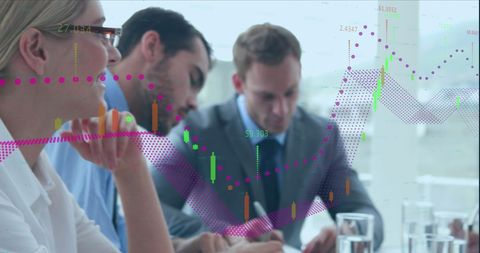 Business professionals analyzing financial graph