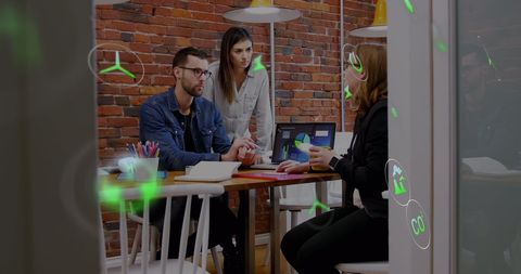 Multiracial Coworkers Discussing Business Project with Digital Technology