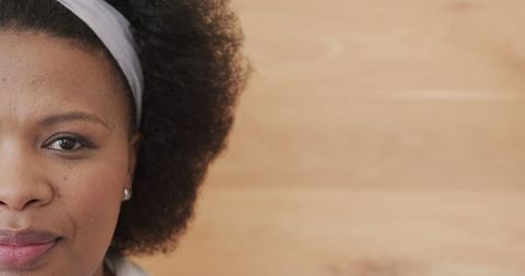 Confident Biracial Woman with Curly Hair and Hairband