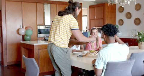 Diverse Friends Sharing Conversation at Dining Table