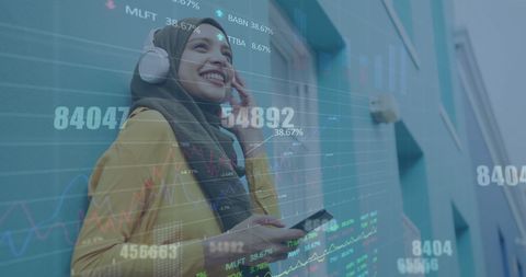 Smiling Woman in Hijab Listening to Music with Data Visualization Overlay