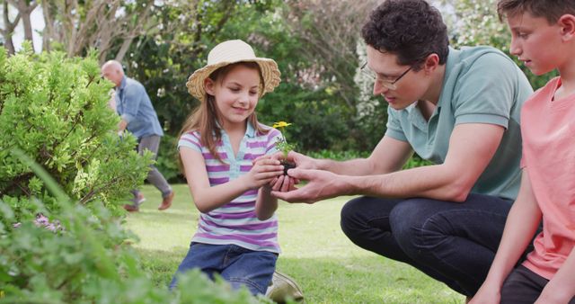 Father and Children Gardening Together in Sunny Backyard - Download Free Stock Images Pikwizard.com