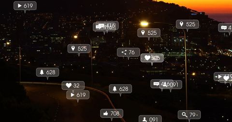 Cityscape at Night with Overlaid Social Media Icons