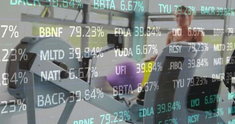 Rowers in Gym with Stock Ticker Reflecting Technology and Finance