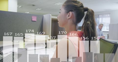 Caucasian Businesswoman Analyzing Financial Data at Office Desk