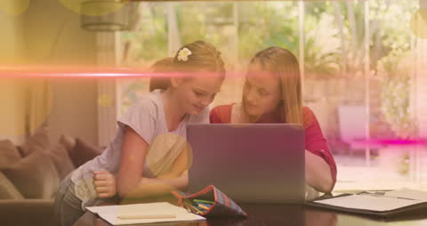 Mother and Daughter Enjoy Learning on Laptop at Home