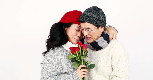 Couple Embracing with Roses for Winter Romance - Download Free Stock Images Pikwizard.com