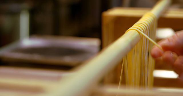 Close-up of Fresh Homemade Pasta Drying on Wooden Rack - Download Free Stock Images Pikwizard.com