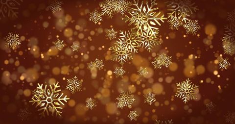 Falling snowflakes with bokeh on a brown christmas background