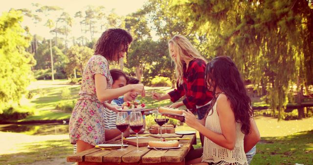 Group of Friends Enjoying Outdoor Picnic with Food and Wine - Download Free Stock Images Pikwizard.com