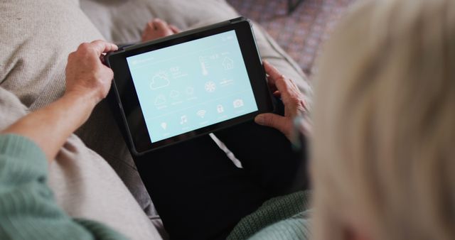 Senior Person Using Tablet for Home Automation Control - Download Free Stock Images Pikwizard.com