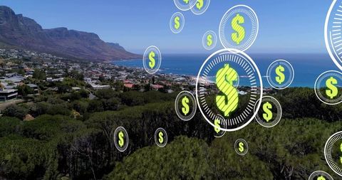 Coastal real estate investment showing floating dollar coin icons over seaside town
