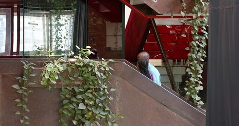 Creative Colleagues Collaborating on Modern Staircase