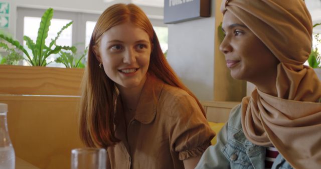 Diverse Friends Smiling and Talking at Café - Download Free Stock Images Pikwizard.com