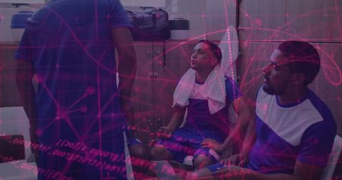 Soccer players resting in locker room with team bonding